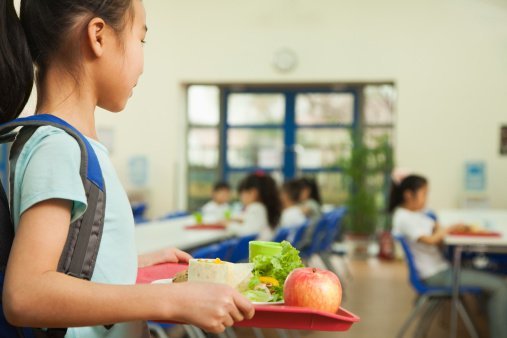 Girl with lunch tray